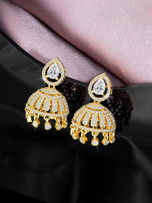 Luxurious Elegance CZ Jhumki Earrings. A pair of gold-colored CZ jhumki earrings with intricate designs and teardrop-shaped stones.