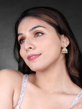 Luxurious Elegance CZ Jhumki Earrings. A pair of gold-colored CZ jhumki earrings with intricate designs and teardrop-shaped stones.