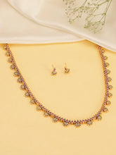 Heritage Faux Ruby Bliss Ethnic Necklace. Golden Necklace with red ruby stones with pair of earrings. Ideal for ethnic wear, festive & special occasions.  