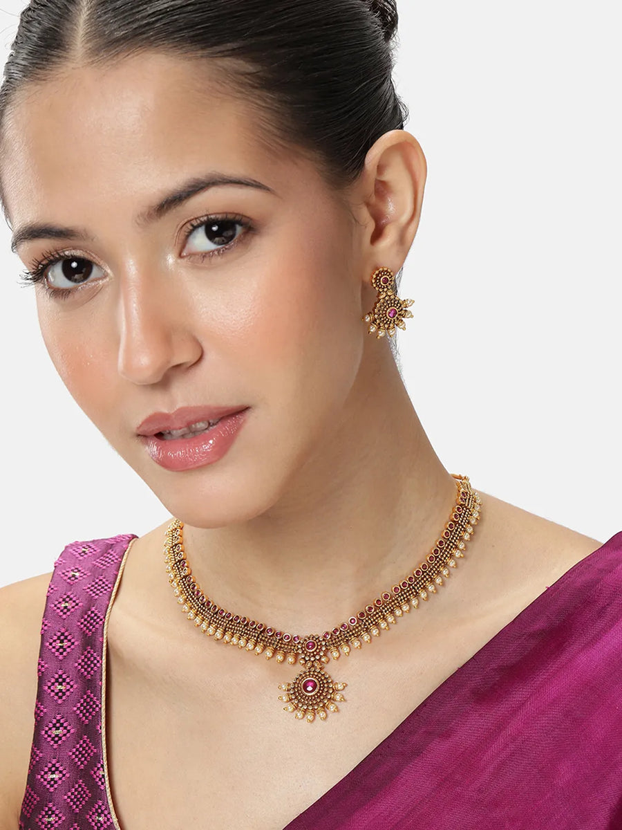 Elegant Faux Ruby Beaded Necklace Set. Gold necklace with pink stones and matching earrings. Best for ethnic, festive wear & special occasion. 