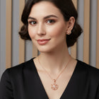 Petite Bloom CZ Floral Pendant Set
 by Peora. Rose gold-plating floral pendant necklace and matching earrings with CZ Stones.