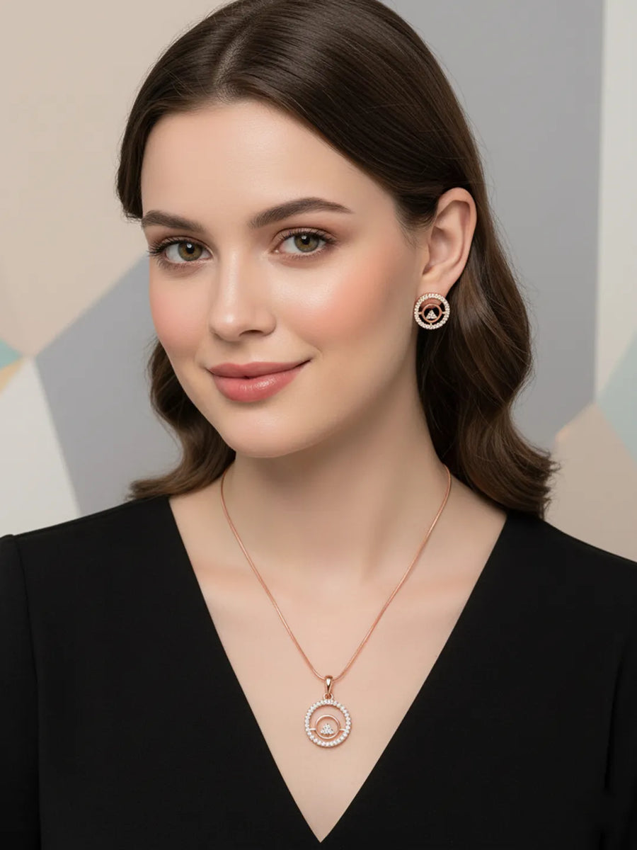 Elegant CZ Round Pendant Orbit Set. Rose gold-plated pendant necklace and a pair of earrings with a round pendant & CZ stones.