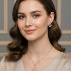 Sparkling Rhombus CZ Pendant Set by Peora. Rose gold-colored pendant set with a rhombus-shaped design with earrings & CZ stones.