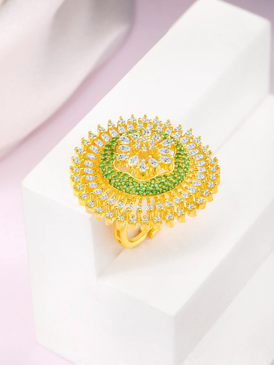 Bold and Glam CZ Statement Ring. Gold-plated adjustable ring with green and white cubic zirconia stones set in a floral pattern.