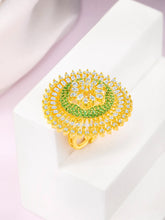 Bold and Glam CZ Statement Ring. Gold-plated adjustable ring with green and white cubic zirconia stones set in a floral pattern.