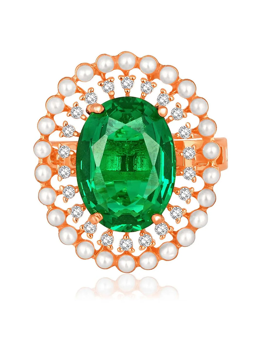 Opulent Green CZ Statement Ring by Peora. Adjustable ring with a rose gold-plating band and smaller white stones, pearls around the green centrepiece.