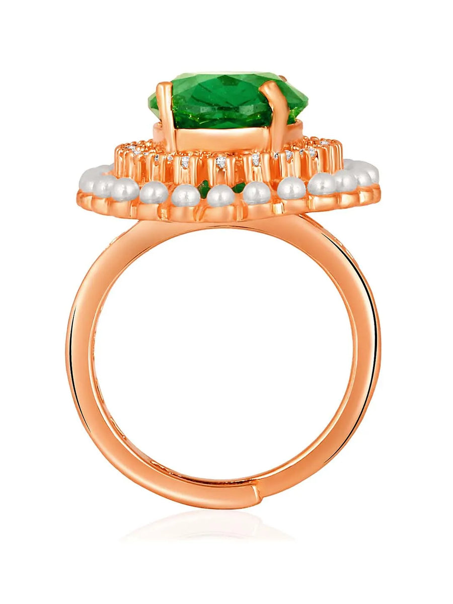 Opulent Green CZ Statement Ring by Peora. Adjustable ring with a rose gold-plating band and smaller white stones, pearls around the green centrepiece.