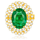 Opulent Green CZ Statement Ring by Peora. Adjustable ring with a gold-plating band and smaller white stones, pearls around the green centrepiece.