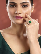 Opulent Green CZ Statement Ring by Peora. Adjustable ring with a gold-plating band and smaller white stones, pearls around the green centrepiece.