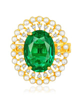 Opulent Green CZ Statement Ring by Peora. Adjustable ring with a gold-plating band and smaller white stones, pearls around the green centrepiece.