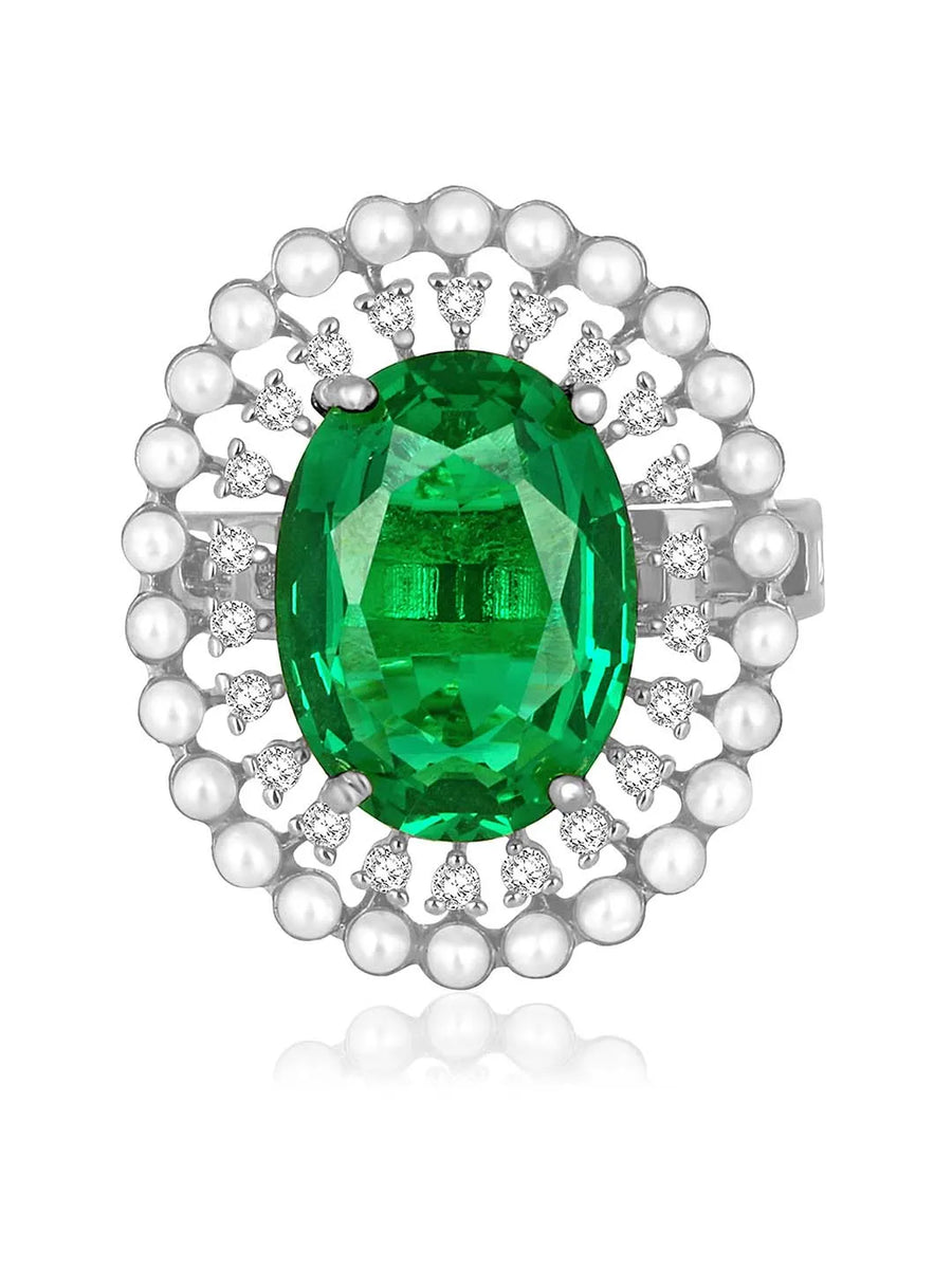 Opulent Green CZ Statement Ring by Peora. Adjustable ring with a silver-plating band and smaller white stones, pearls around the green centrepiece.