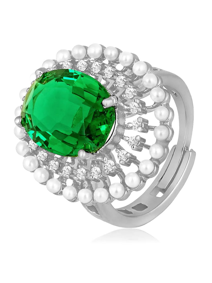 Opulent Green CZ Statement Ring by Peora. Adjustable ring with a silver-plating band and smaller white stones, pearls around the green centrepiece.