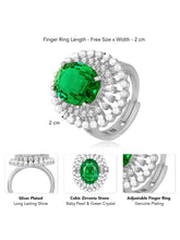 Opulent Green CZ Statement Ring by Peora. Adjustable ring with a silver-plating band and smaller white stones, pearls around the green centrepiece.