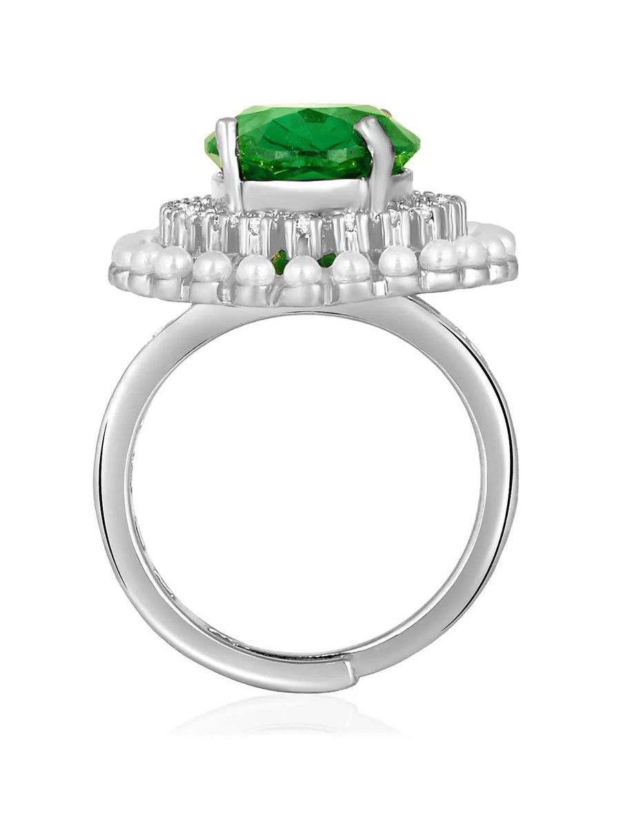 Opulent Green CZ Statement Ring by Peora. Adjustable ring with a silver-plating band and smaller white stones, pearls around the green centrepiece.