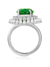 Opulent Green CZ Statement Ring by Peora. Adjustable ring with a silver-plating band and smaller white stones, pearls around the green centrepiece.