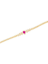 Gold Belly Chain with a heart-shaped pink gemstone on a white background