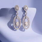 Peora Rhodium Plated Double Oval CZ Earrings