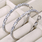 Radiant Hoop with CZ Sparkle. Pair of silver hoop earrings with clear gemstones. Ideal for causal, party wear & daily wear.