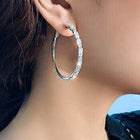 Radiant Hoop with CZ Sparkle. Pair of silver hoop earrings with clear gemstones. Ideal for causal, party wear & daily wear.