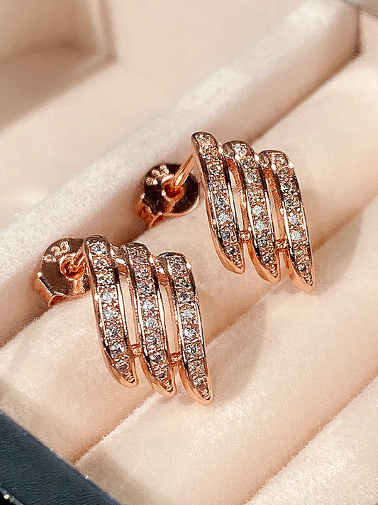 Twilight Spark Cubic Zirconia Hoops | Everyday & Party Wear. Rose gold earrings with diamond accents. Prefect for daily & casual wear.