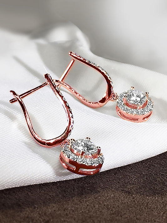 Twilight Spark rose gold dangler hoop earrings adorned with clear cubic zirconia gemstones