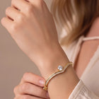 Peora Solitaire Wave Crystal Bangle - Gold