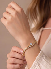 Peora Solitaire Wave Crystal Bangle - Gold