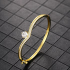 Peora Solitaire Wave Crystal Bangle - Gold