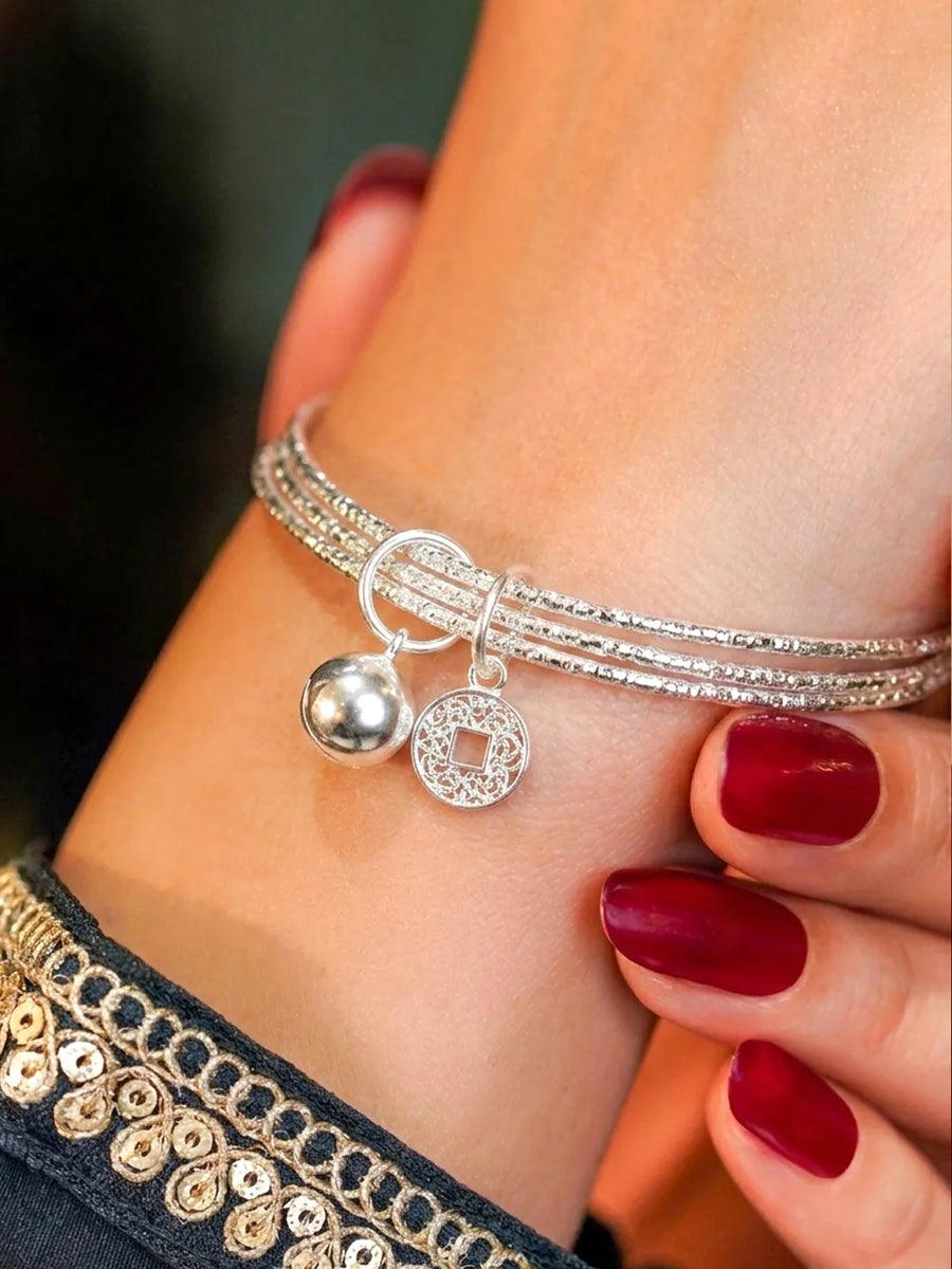 Rhodium Plated Coin Bell Charm Bracelet