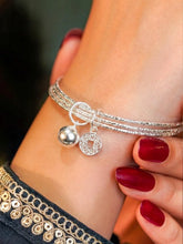 Rhodium Plated Coin Bell Charm Bracelet