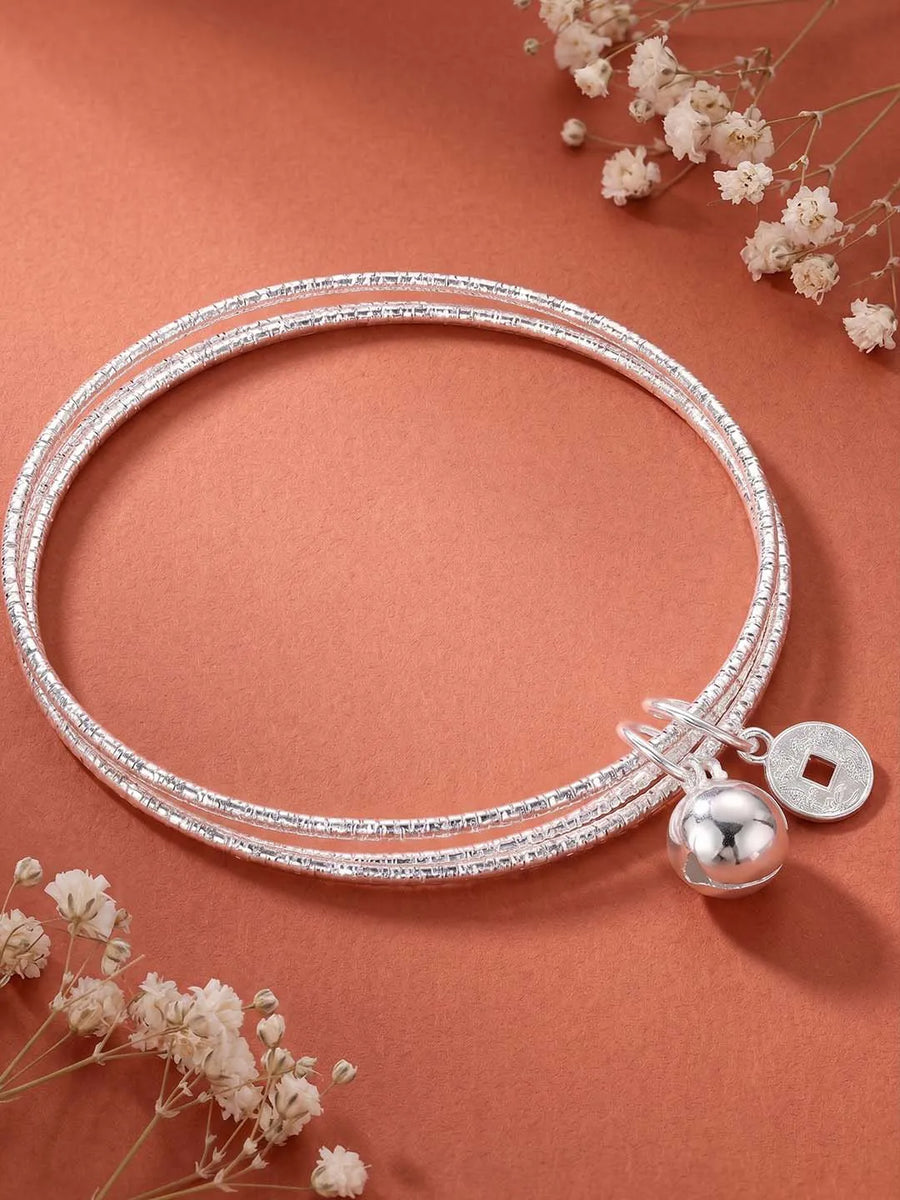 Rhodium Plated Coin Bell Charm Bracelet