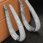 Peora Sparkling CZ Pave Oval Hoop Earrings