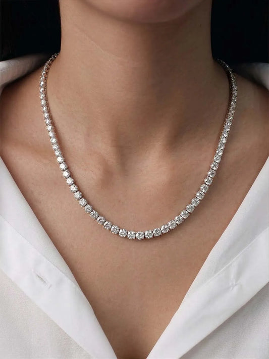 CZ Diamond Tennis necklace from peora on a person wearing a white shirt 
