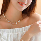 Timeless Glow Pearl Necklace Set featuring white pearls with gold-plated chain, matching bracelet, and earrings