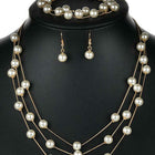 Timeless Glow Pearl Necklace Set featuring white pearls with gold-plated chain, matching bracelet, and earrings