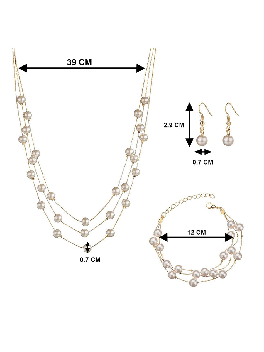 Timeless Glow Pearl Necklace Set featuring white pearls with gold-plated chain, matching bracelet, and earrings