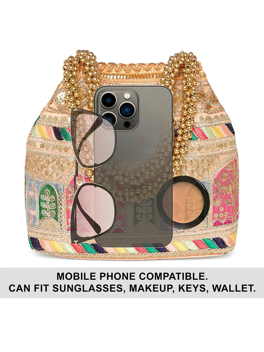 Peach potli bag named Ethnic Embroidered Potli Purse, featuring artificial beads detailing and soft fabric texture | Peora
