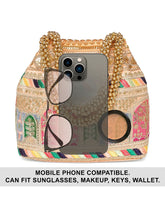 Peach potli bag named Ethnic Embroidered Potli Purse, featuring artificial beads detailing and soft fabric texture | Peora
