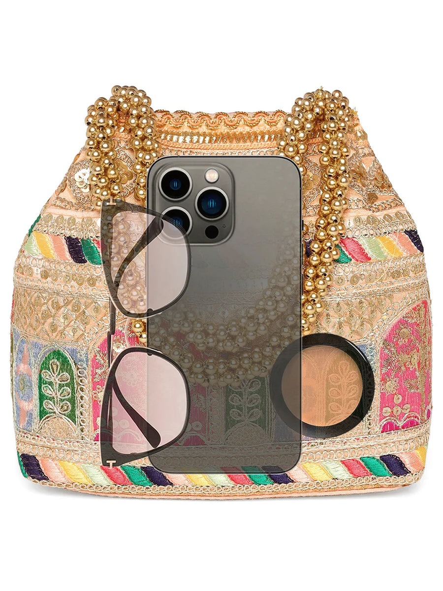 Peach potli bag named Ethnic Embroidered Potli Purse, featuring artificial beads detailing and soft fabric texture | Peora
