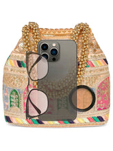 Peach potli bag named Ethnic Embroidered Potli Purse, featuring artificial beads detailing and soft fabric texture | Peora

