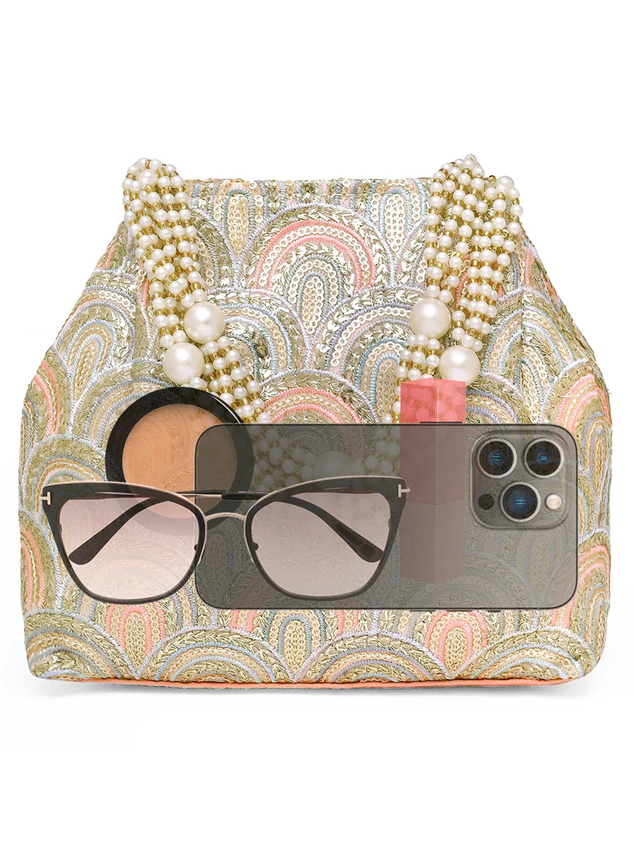 Peach potli bag named Sequin Wave Embellished Potli Bag, featuring artificial beads detailing and soft fabric texture | Peora
