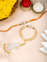 Close-up of Pearls & Beads Rakhi with Chain Tassel featuring mustard yellow & white thread, pearl & beads work, and gold plating – ideal for Raksha Bandhan | Peora
