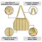 Gold potli bag named Traditional Pearl Cluster Potli Bag, featuring faux pearl detailing and soft fabric texture | Peora
