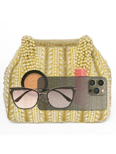 Gold potli bag named Traditional Pearl Cluster Potli Bag, featuring faux pearl detailing and soft fabric texture | Peora
