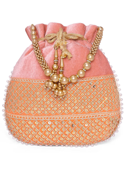 Pink potli bag named Pearl Trim Zari Bead Potli Bag, featuring artificial beads detailing and soft fabric texture | Peora
