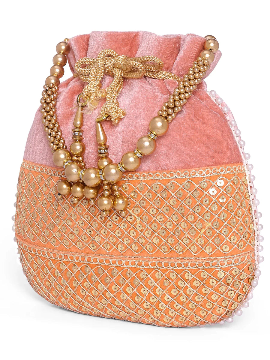 Pink potli bag named Pearl Trim Zari Bead Potli Bag, featuring artificial beads detailing and soft fabric texture | Peora
