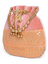 Pink potli bag named Pearl Trim Zari Bead Potli Bag, featuring artificial beads detailing and soft fabric texture | Peora
