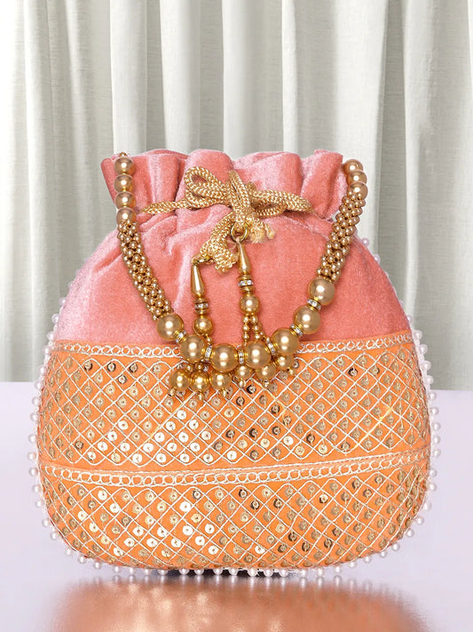 Pink potli bag named Pearl Trim Zari Bead Potli Bag, featuring artificial beads detailing and soft fabric texture | Peora
