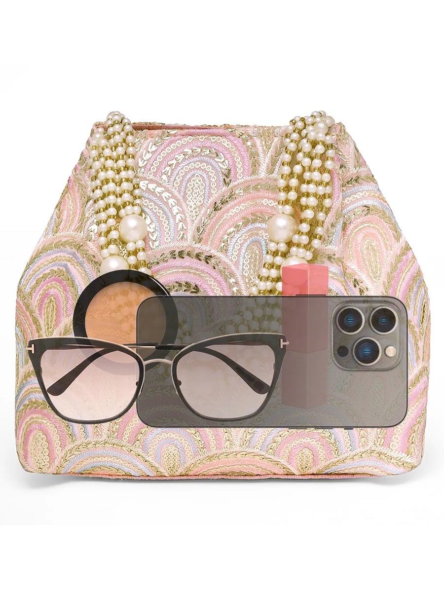 Pink potli bag named Sequin Wave Embellished Potli Bag, featuring artificial beads detailing and soft fabric texture | Peora
