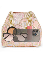 Pink potli bag named Sequin Wave Embellished Potli Bag, featuring artificial beads detailing and soft fabric texture | Peora
